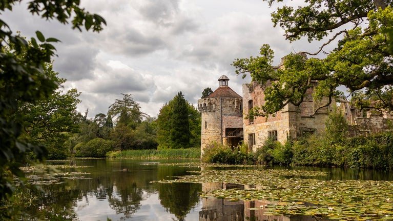 View across the moat to the Old Castle, the reflection of the exterior shows in the calm water